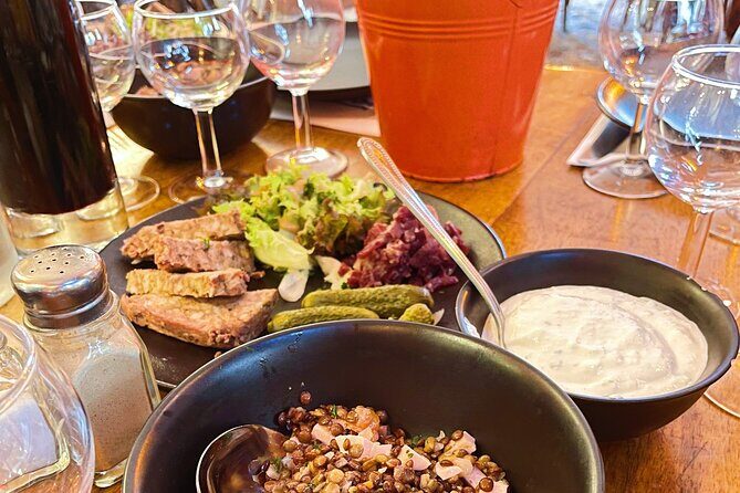 Embark on an aperitif journey through the old town - The food plan: charcuterie, cheese, and Lyonnais tastings in three stops